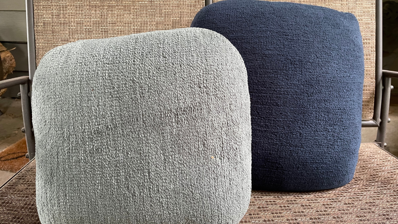 Two grey and navy-blue Quiet Mind Weighted Pillows side-by-side.