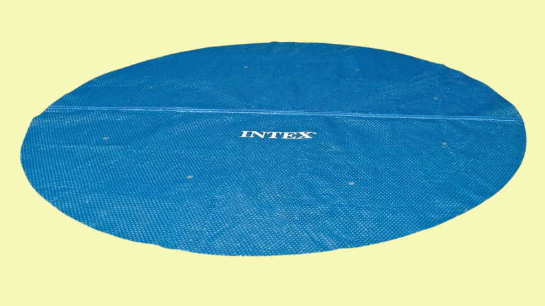 A circular, blue pool cover from Intex appears on a white background.
