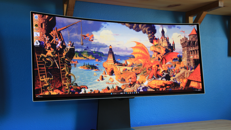 OLED gaming monitor featuring a video game on the screen with a blue background.