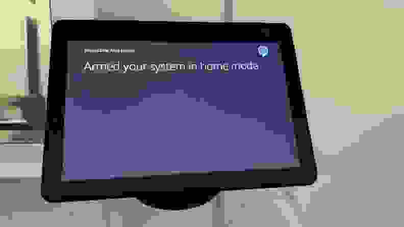 Amazon Echo Show 10 controlling a SimpliSafe wireless home security system.