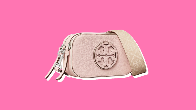 Photo of the Tory Burch Mini Miller Crossbody Bag against a fuchsia background.