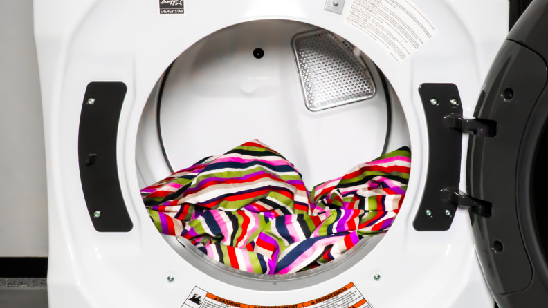 Close-up of the Whirlpool WED6620HW dryer's drum, which has a colorful blanket for scale and a pop of color.