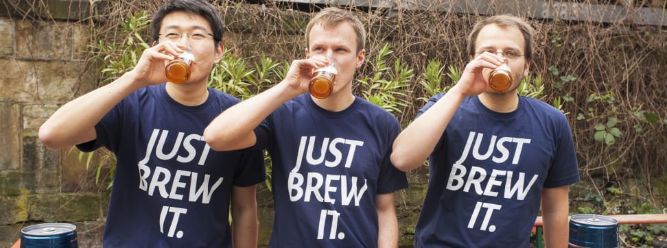 The three BrewBarrel co-founders drink beer