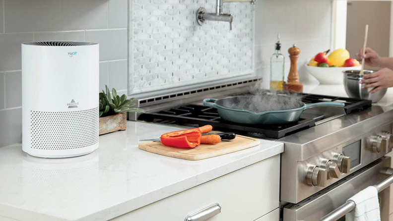 A Bissell MYAir purifier sits on a kitchen counter.