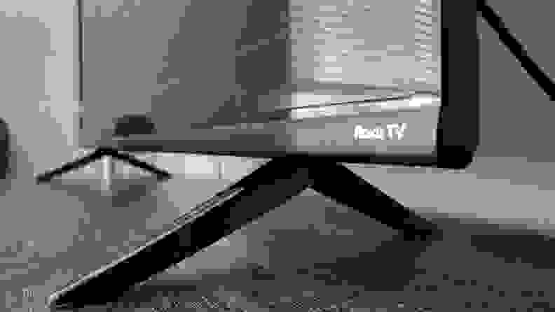 The TCL 4-Series' tabletop feet and side of panel, showing the Roku TV logo