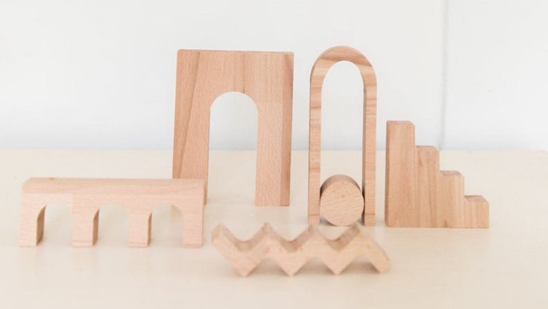 An image of a set of decorative wooden items, including arches and stairs.