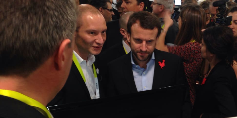 French Minister of Economy, Industry and Digital Affairs Emmanuel Macron, right, visits with French Startups Thursday at CES.