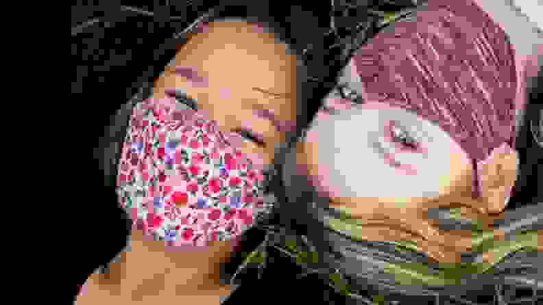 Two girls in floral masks