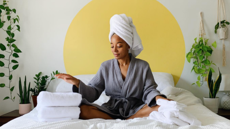 A woman folding towels.