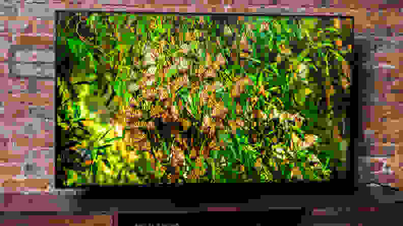 The Samsung QN90B displaying 4K/HDR content in a living room setting