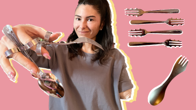 One-armed person smiling while holding up assorted cutlery perfect for one-handed use that makes eating easier.