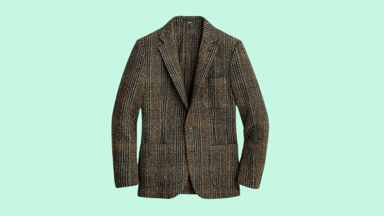 A plaid wool blazer against a green background.