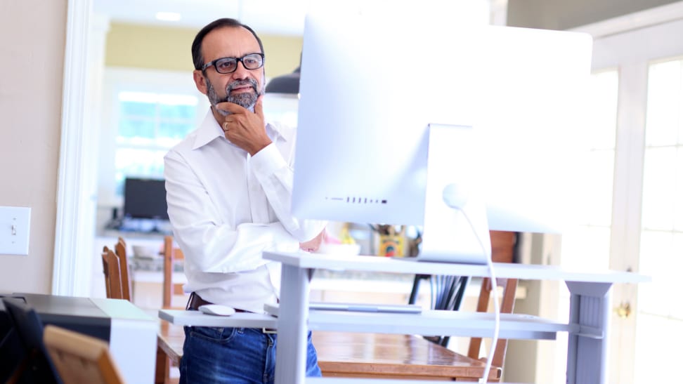 man experiences benefits of a standing desk