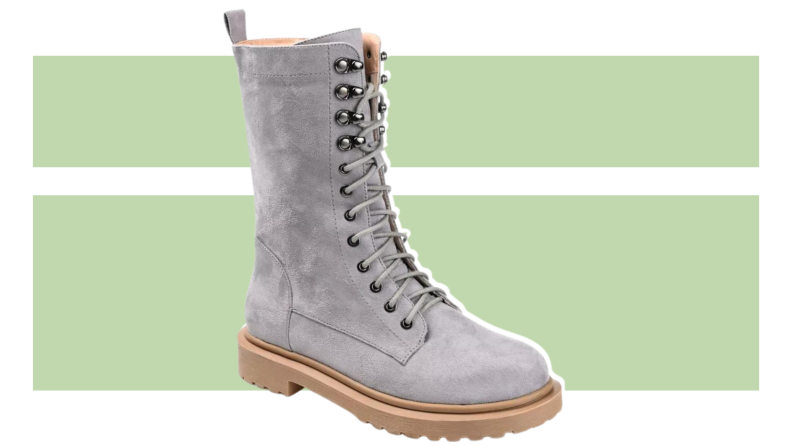 Gray suede boots that hit mid-calf.