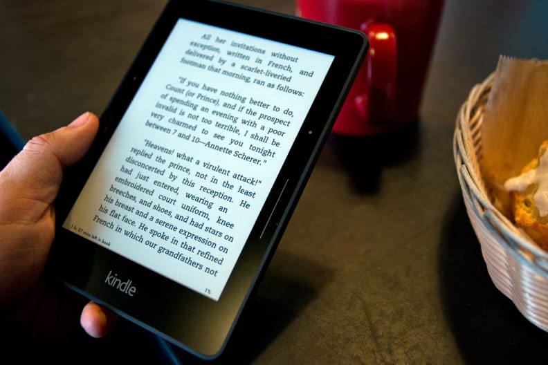 A photo of the Amazon Kindle Voyage being held.