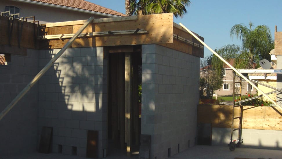 Safe room under construction with concrete walls, floor, and ceiling