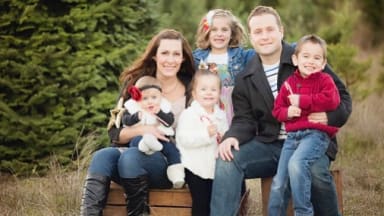 A large family taking a photo for their Christmas card.