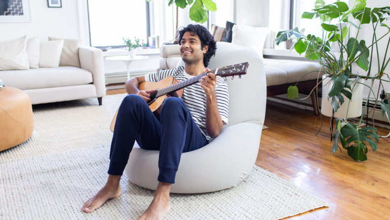 Moon Pod chair sitting man