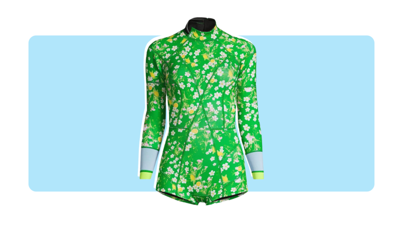 A green wetsuit with floral print.