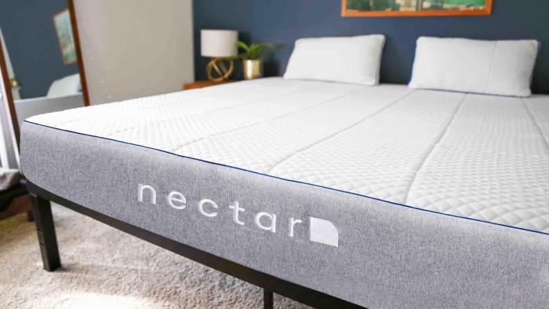 Nectar mattress in bedroom on black frame.