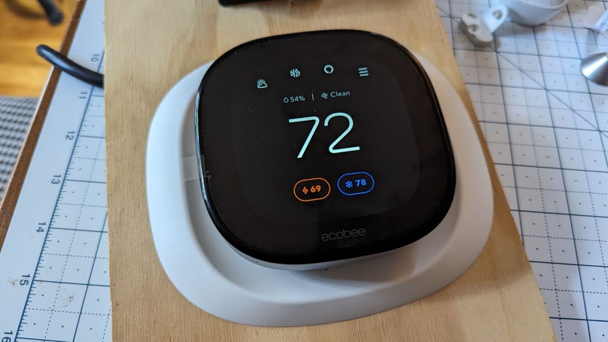 The Ecobee Smart Thermostat Premium is shown mounted on a board for testing.