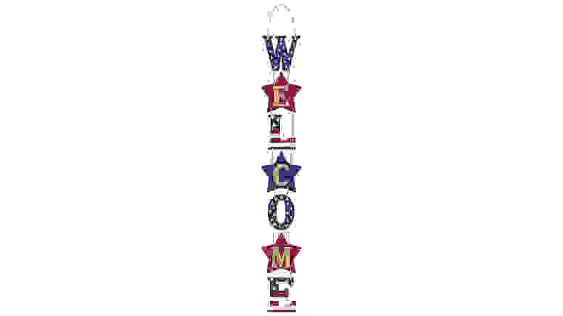 Sign that says "Welcome" in red, white, and blue colors