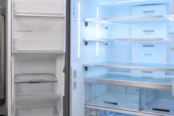 The slim ice maker is found on the left door, which features additional shelves.