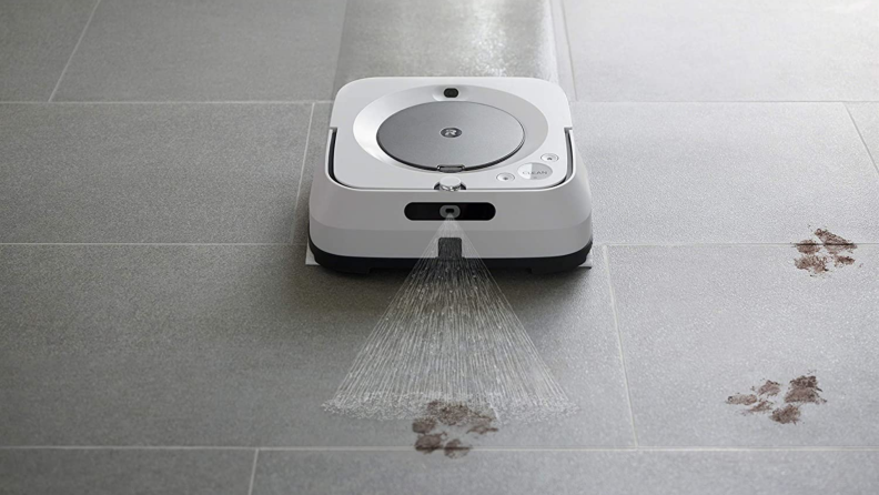 A robot mop slides down a tile floor.