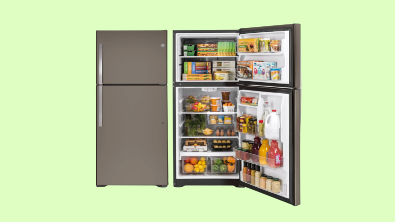Two GE GTS22KGNRBB top-freezer refrigerators side by side, one with its doors closed, one with its doors open, revealing fully stocked shelves and bins.