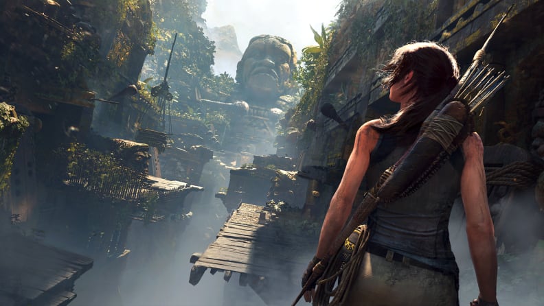 Screenshot of Shadow of the Tomb Raider, with Lara looking at some ruins.