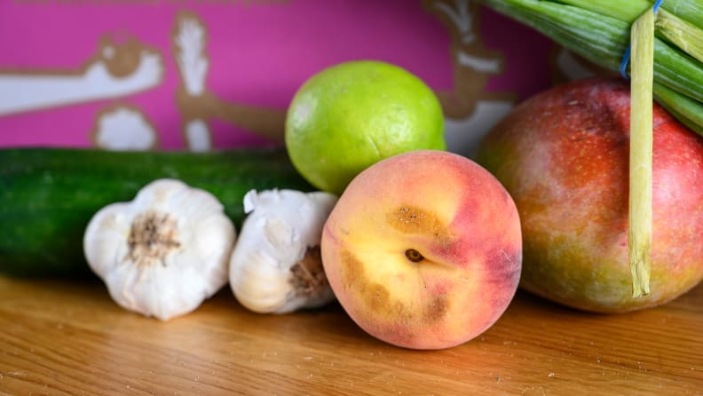 A bruised white peach.