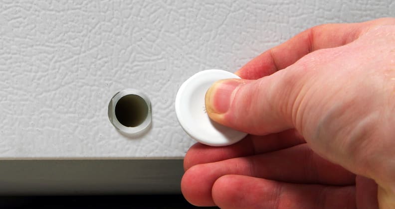 The Whirlpool EH151FXTQ's small external drain is right on the front of the unit. An internal drain is on the bottom of corresponding corner.