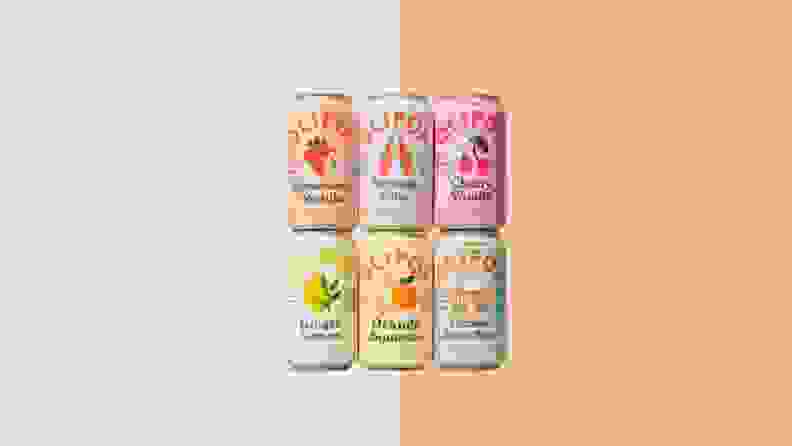 Six Olipop cans on orange background.