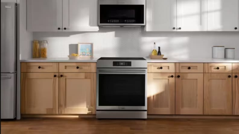 A range sits in cabinetry in a kitchen setting