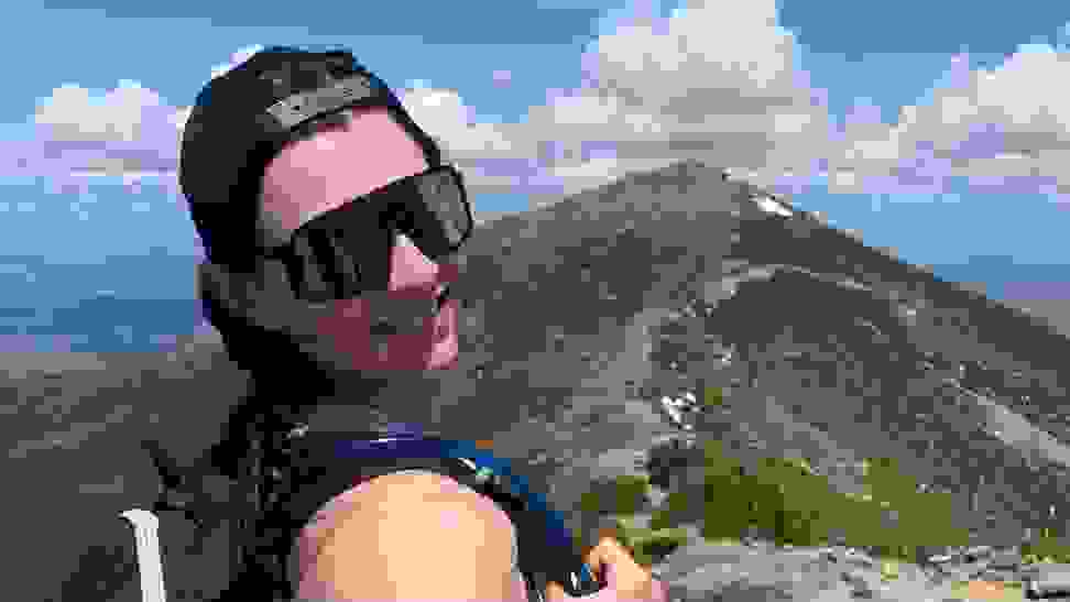 Staff Writer Lily Hartman wearing her Oakley sunglasses on the Franconia Ridge.