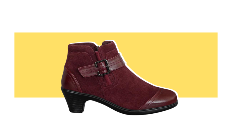 A dark red suede bootie with a low heel.