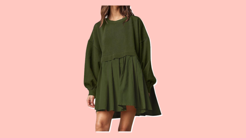 A front view of the midsection of a model wearing an Ugerlov oversized sweatshirt dress in olive green.