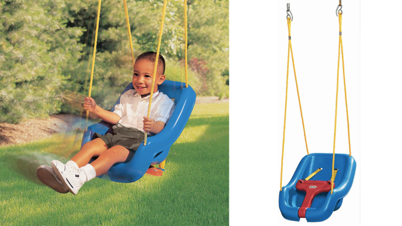 A toddler in a plastic swing