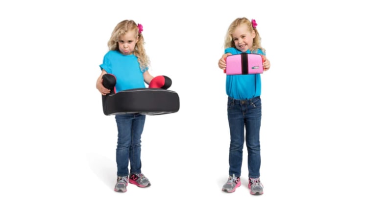 A little girl holds up a typical booster and a mifold booster.