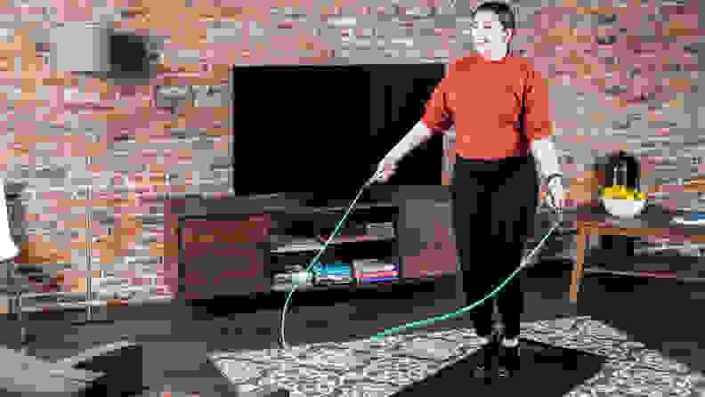 woman jumping rope at home.