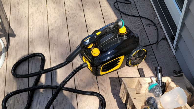 A steam cleaner on a brown deck