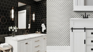 On the left, a bathroom with black subway tile and white furniture. On the right, a small tile design of black and white with a white sink.