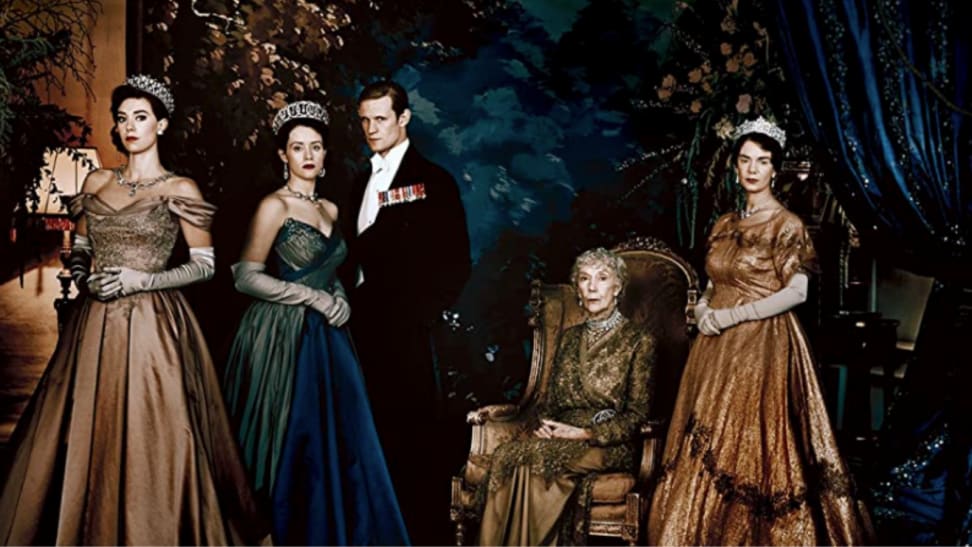 A still from the first series of The Crown featuring all the royals in gowns and suits.