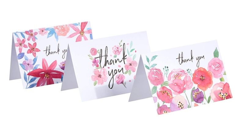 Three floral thank you notes stacked in front of each other.