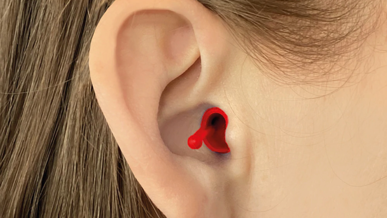 Person wearing red earbud in ear canal to block out sound.