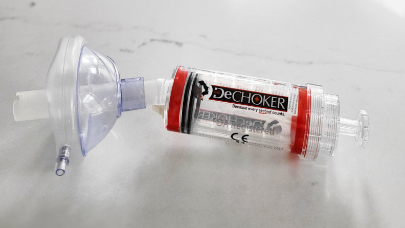 Dechoker anti-choking device sitting on countertop.