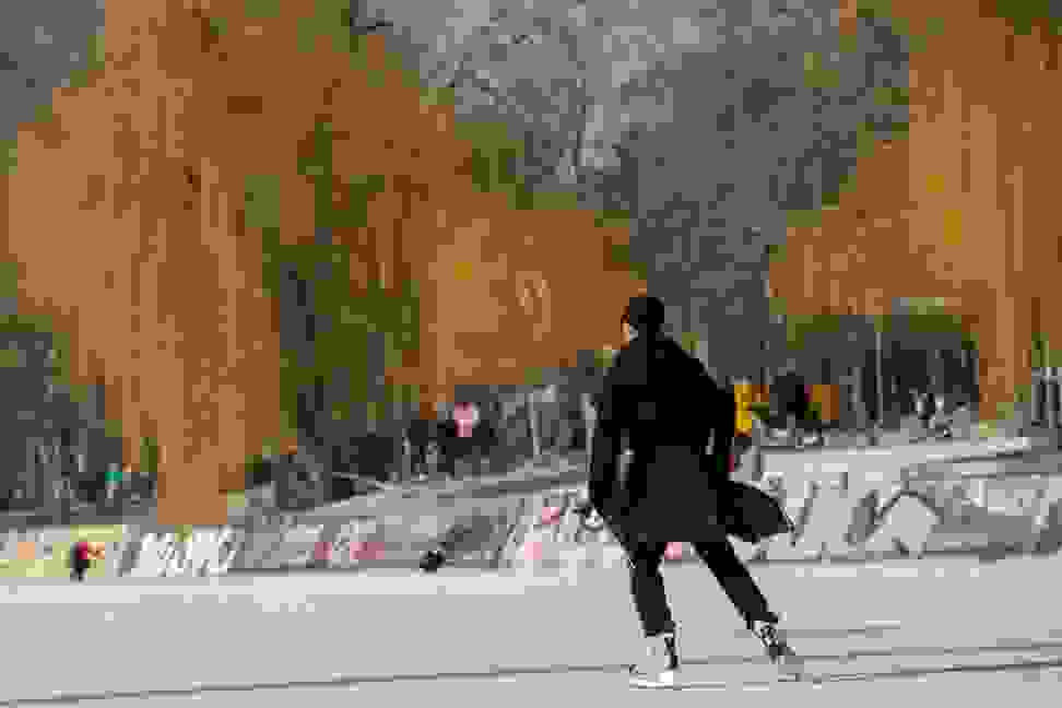 Photo of a person ice skating in the park.