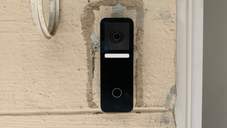 The Logitech Circle View Doorbell Wired on the front of a house.