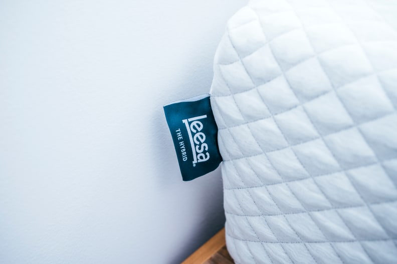 the corner of the leesa hybrid with the tag poking out