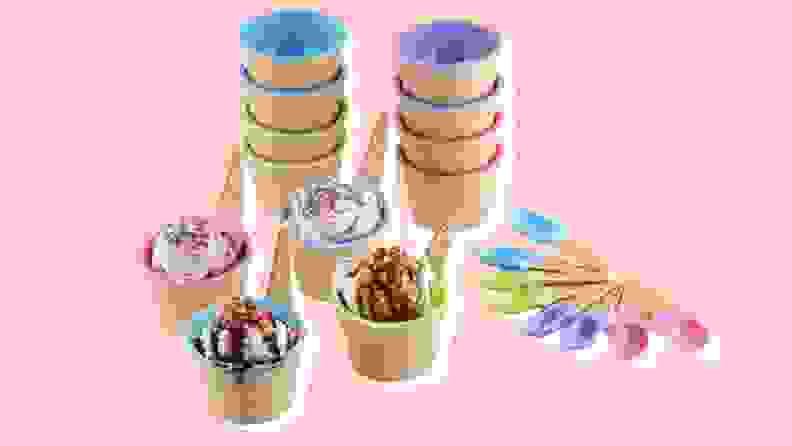 年代everal colorful ice-cream themed cups and bowls on a pink background